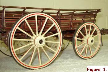 This 1/12th scale model of a Farm Waggon by “Radish” shows all the detail of the outstanding craftsmanship of a model wheelwright. The staggered spokes are set in wooden hubs and the steel tyres are given an authentic appearance by first placing them on the electric hotplates until they turn blue, and then rubbing them down with steel wool.